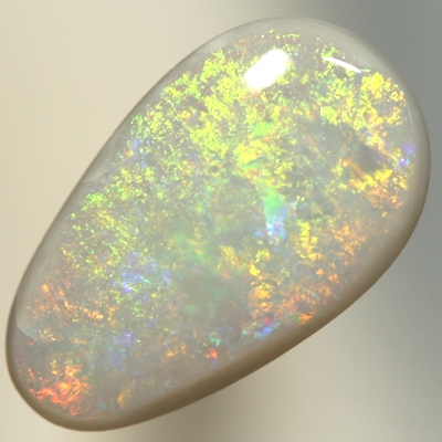 SOLID SEMI BLACK OPAL Orange and green move gently over a medium dome